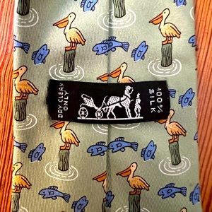 Vintage Hermes silk tie with pelicans and fish. A whimsical classic!